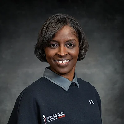 Katanya Ford Selby Smiling In Front Of Grey Background